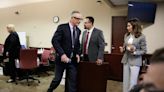 Baldwin trial paused as lawyers file to dismiss over 'buried' bullets