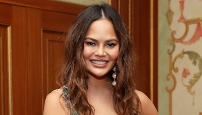 Chrissy Teigen Covers 'SI Swimsuit' in Barely There One-Piece 10 Years After Her Last Sexy Appearance