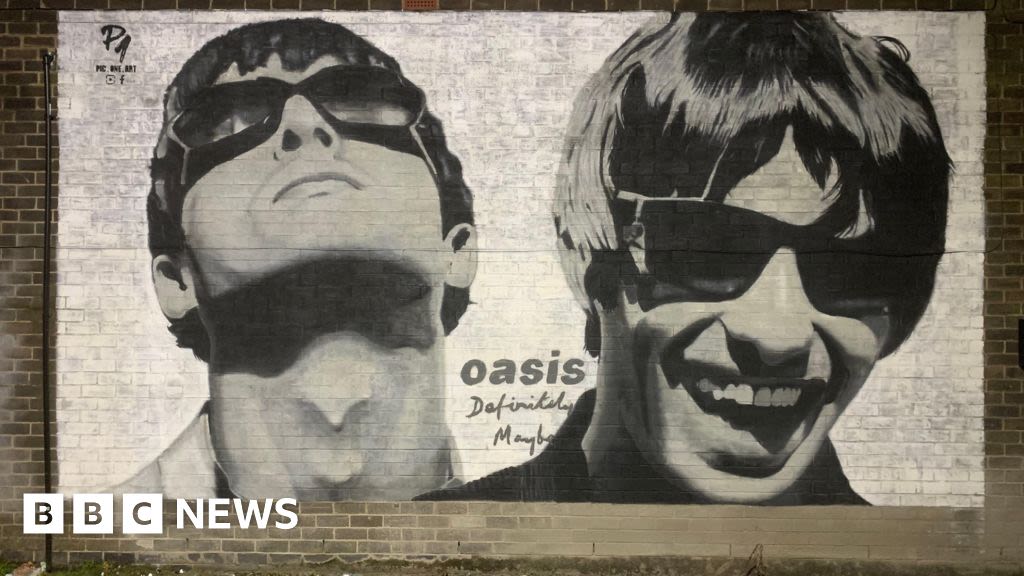 Mural appears on Manchester record shop featured in Oasis track