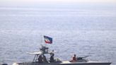 U.S., Iran have tense encounter at sea; Tehran preps new centrifuges