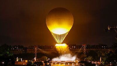 Olympics opening ceremony: Flying cauldron and Celine Dion close spectacular (rain-hit) event