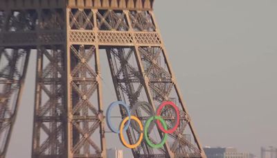 Police arrest shirtless man climbing the Eiffel Tower, prompting an evacuation hours before closing ceremony