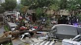 Massive tree falls across busy road in Malaysian capital, killing one man, damaging cars