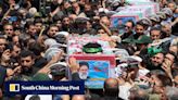 Mourners pack Iranian city for President Raisi’s burial