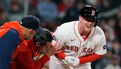 Red Sox trade addition Garrett Cooper exits game after being hit in wrist