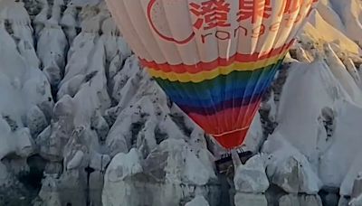 Giant hot air balloon packed with tourists slams into rock formations