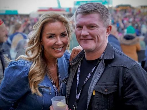 Loved up Ricky Hatton and Claire Sweeney are all smiles as they join thousands at festival