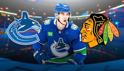 Canucks clear cap space with Blackhawks trade