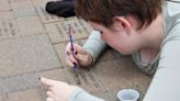 SEEN: Dow High students repaint bricks at veterans memorial