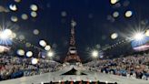 AP PHOTOS: Paris glitters in the rain for ambitious Olympic opening ceremony