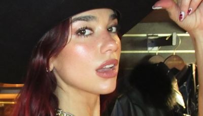 Dua Lipa flaunts her jaw-dropping figure in a TINY leather hot pants