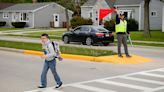 Here's how one Manitowoc teacher is using his Road America flag skills to keep kids safe on their way to school