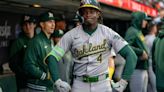 A's bash four home runs, cruise to win over Giants