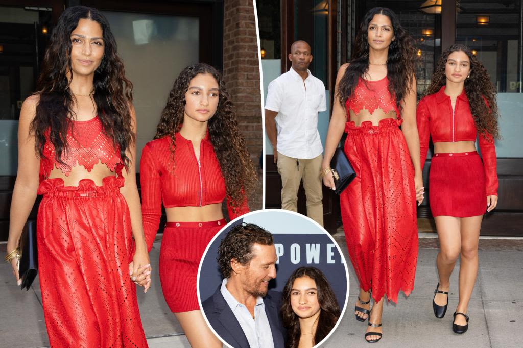 Matthew McConaughey’s wife Camila Alves and daughter Vida, 14, twin in red