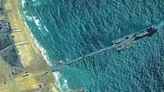 Trucks roll off U.S. floating pier bringing humanitarian aid ashore in Gaza