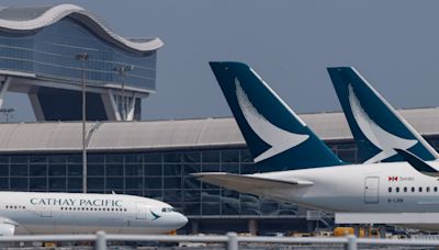 Cathay Pacific says profit drops on lower fares, growth plan on track