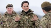 Kate sports camo outfit as she braves the snow to visit the Irish Guards