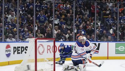 Canucks overcome 3-goal deficit to stun Oilers 5-4 in Game 1 - WTOP News