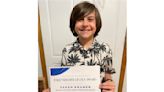 A fifth grader's fundraiser cleared his school of meal debt. It named an award for him