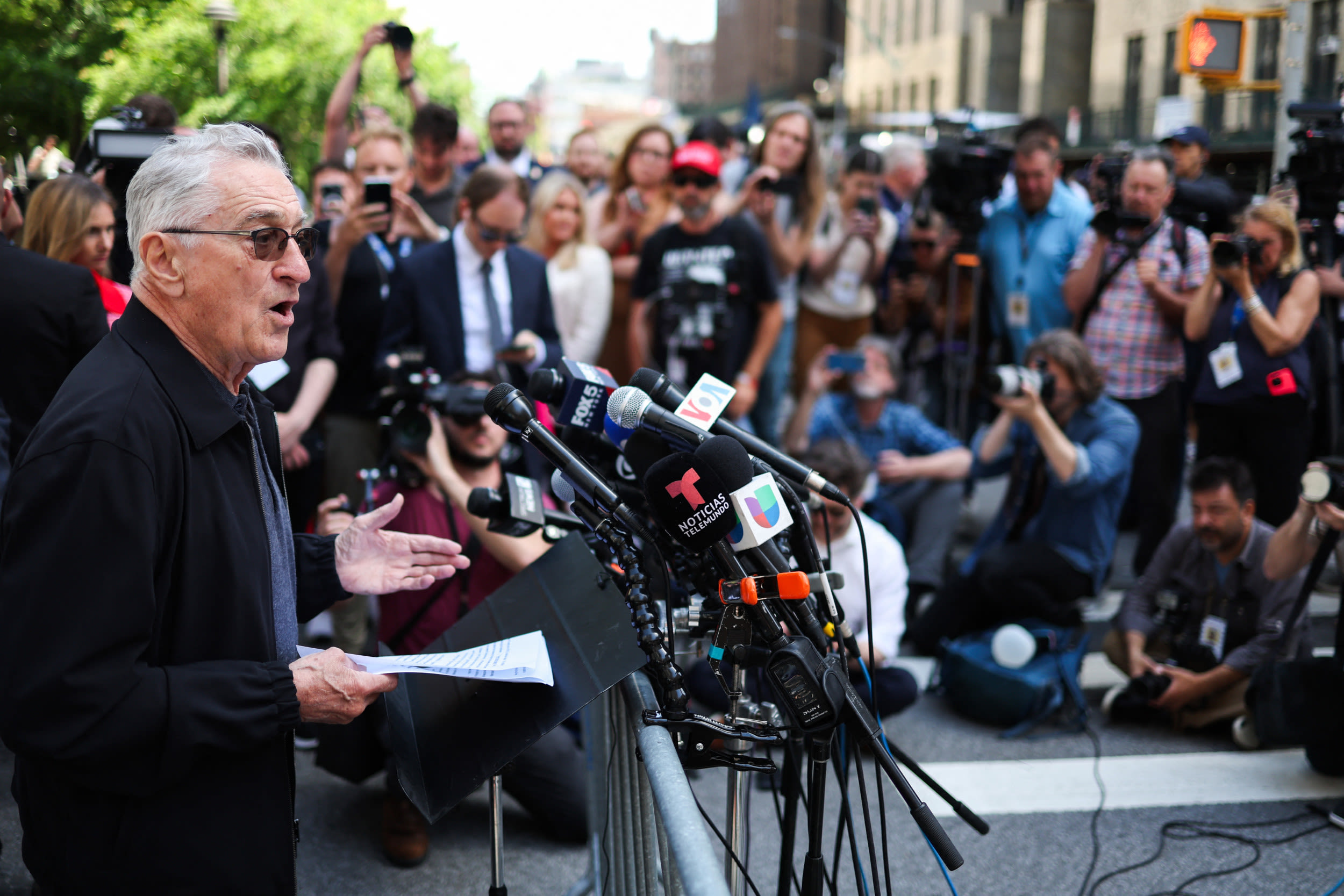 Robert De Niro clashes with Trump supporters outside court