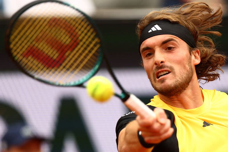 Tennis-Tsitsipas eases into French Open second round