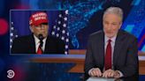 ‘The Daily Show’: Jon Stewart Mocks Donald Trump’s Word Struggles; Desi Lydic Jokes Democrats Want Trump Cast As ‘Golden...
