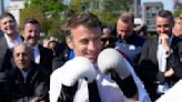 France's president pounds a punching bag on camera, and Europe notices