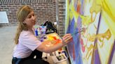 Who painted that mural at the Indiana State Fair? Local artists add color to Swine Barn.