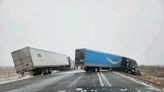 Major Nebraska interstate closes as jacknifed tractor trailers block snowy roadway