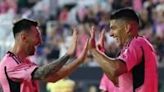 Luis Suarez celebrates with Lionel Messi after scoring his third goal against the New York Red Bulls in Saturday's 6-2 win.