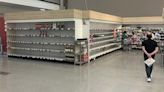 Some grocery beer and wine shelves almost empty as ‘panic buying’ ramps up