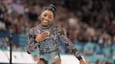 Simone Biles says she has calf issue during Olympic gymnastics qualifying but keeps competing