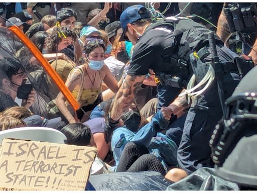 Riot police drag away protesters at University of Texas as Gaza tensions flare