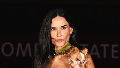 Demi Moore Dons Lace Slip Dress, Accessorizes With Pup Pilaf at Gucci Show