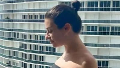 Pregnant Lea Michele displays her baby bump in a black bikini and beach skirt as she poses for Instagram snaps during Florida getaway