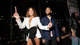 Chrissy Teigen Puts Coquette Spin on Suiting in White Blazer Featuring Statement Bow for JBL Fest 2024 With John Legend
