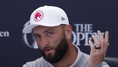 Jon Rahm's caddie Adam Hayes gets struck in the face at The Open