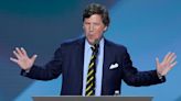 Tucker Carlson claims that Trump offered to stand guard outside his house in unscripted speech to ‘leader’
