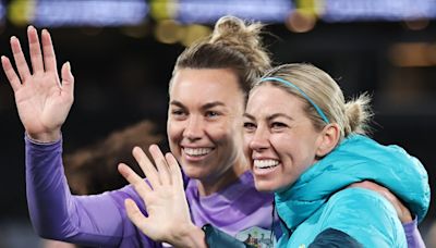Australian soccer players Mackenzie Arnold and Alanna Kennedy mock Olympic uniform designs