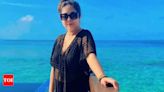 Sreemoye Chattoraj poses in a lacy black dress by the pool in Maldives - Times of India