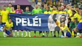 Brazil players display banner in support of Pele after seeing off South Korea