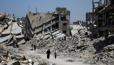 Bodies trapped in Gaza City under Israeli assault as mediators push for truce