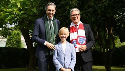 Dublin boy treated for rare illness presents Harris and Starmer with football shirts - Homepage - Western People