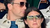 Jools Oliver looks VERY relaxed lying on husband Jamie at Wimbledon