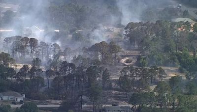 Homes evacuated as crews battle brush fire in Highlands County