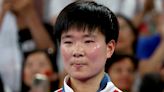 Fans hail 'true Olympian' as Chinese star holds up Spain flag