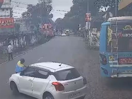 Caught on cam: Kerala policeman drives car with petrol pump staff on bonnet for 1km