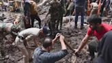 India landslides: Rescuers dig through mud in desperate search for survivors