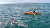 Holland man starts swimming across Lake Michigan, track his progress online