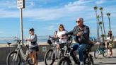 In the South Bay, e-bikes are restricted along the beach. Yet they're still everywhere